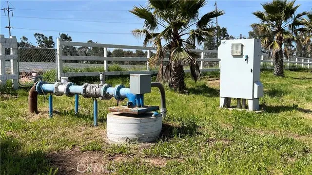 a view of a chairs and table in backyard of the house