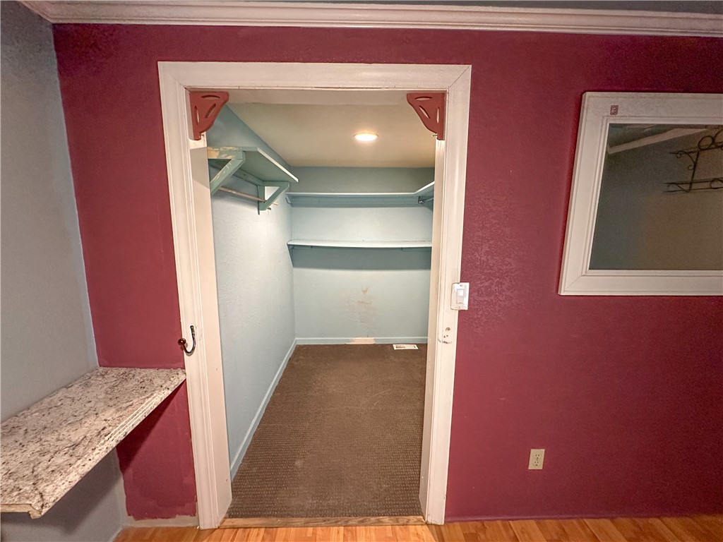 1655 Ramar Road Bullhead City, AZ 86442 - Photo 19 of 49 Walk in closet featuring light carpet