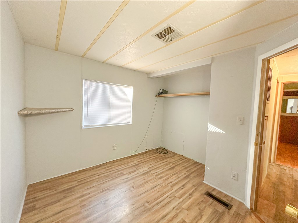 1655 Ramar Road Bullhead City, AZ 86442 - Photo 24 of 49 Empty room featuring light wood finished floors
