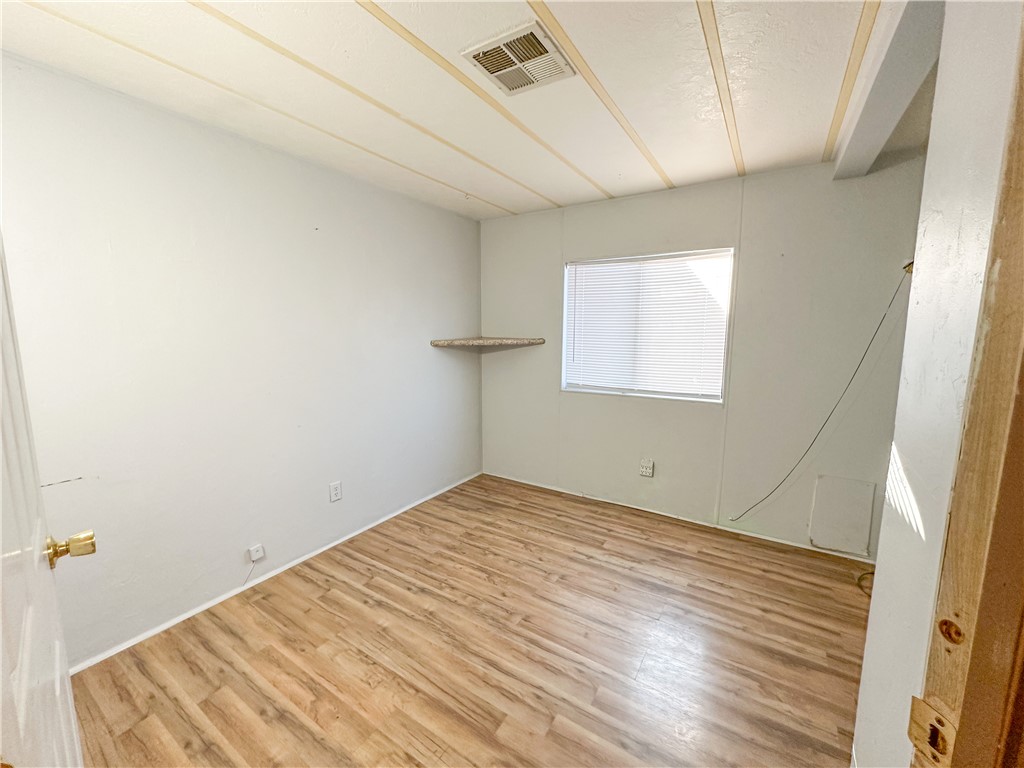 1655 Ramar Road Bullhead City, AZ 86442 - Photo 25 of 49 Unfurnished room featuring light wood-style floors