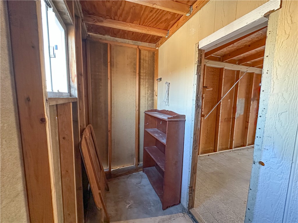 1655 Ramar Road Bullhead City, AZ 86442 - Photo 31 of 49 Misc room featuring wood ceiling and wood walls
