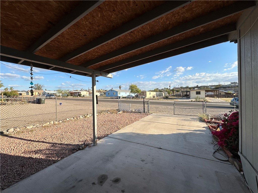 1655 Ramar Road Bullhead City, AZ 86442 - Photo 40 of 49 View of patio / terrace with a residential view and a gate