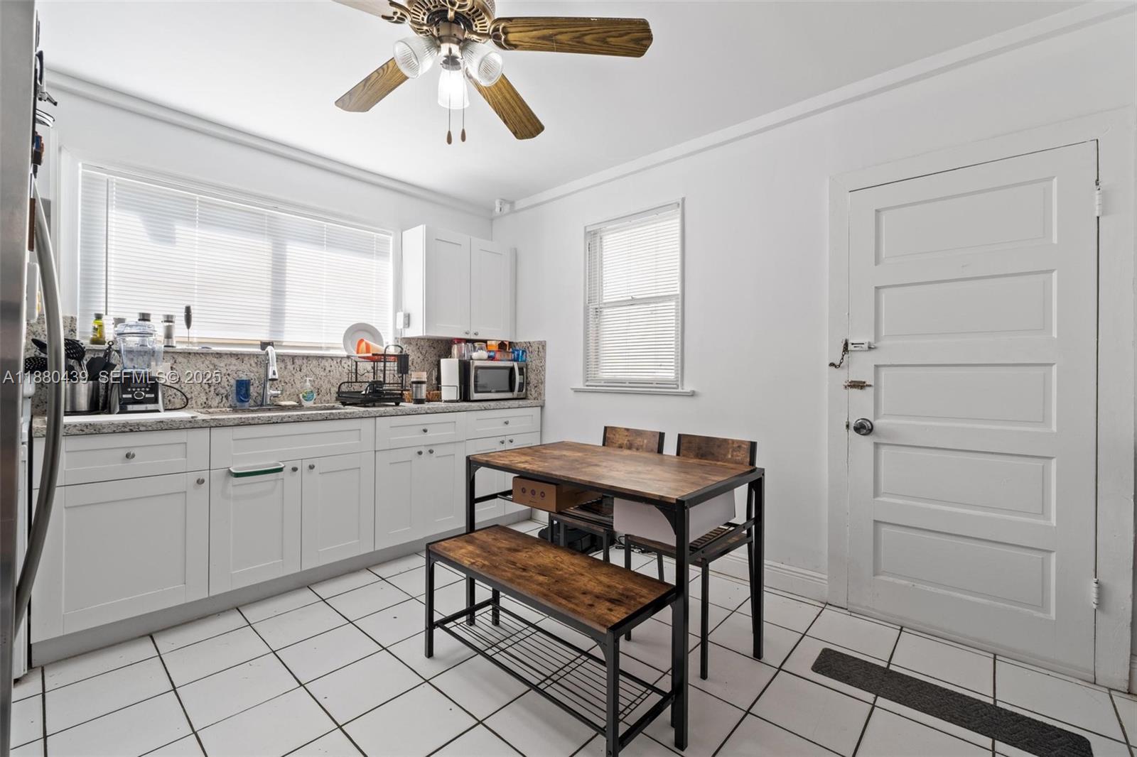 2453 Southwest 17th Street, Unit 2 Miami, FL 33145 - Photo 3 of 7 a kitchen with a sink cabinets and window