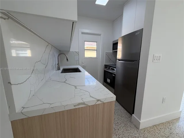 a view of a livingroom with a staircase