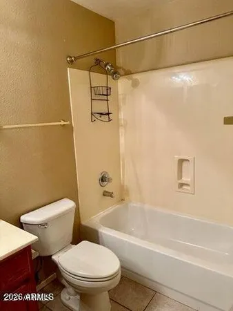 a bathroom with a sink and mirror with toilet