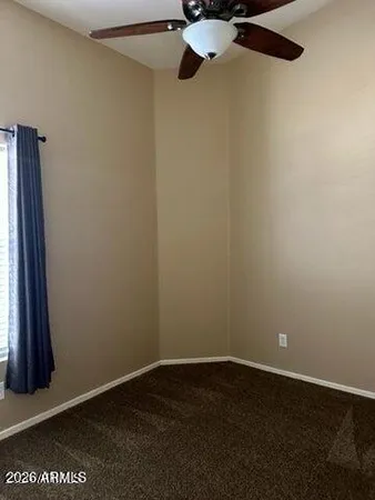 an empty room with closet area