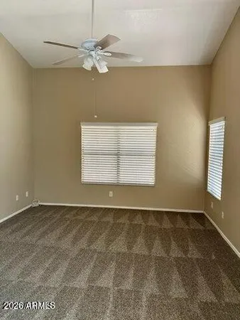 a view of a livingroom with a dishwasher and dresser
