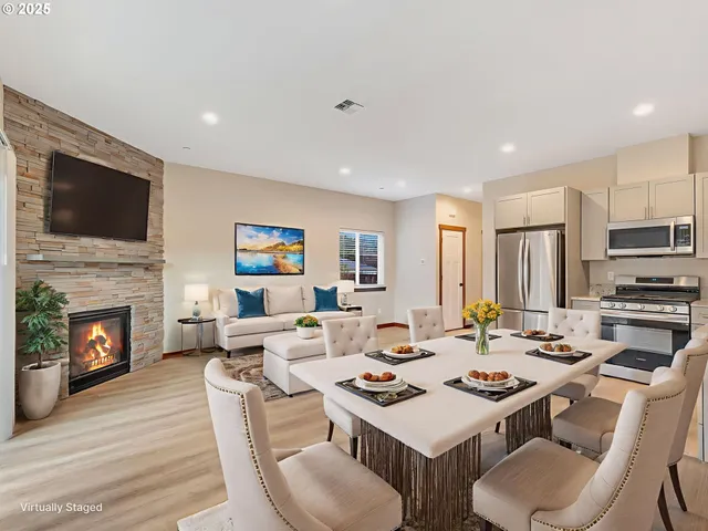 a living room with fireplace furniture and a flat screen tv