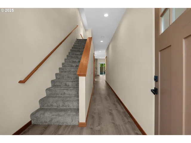 a view of entryway with wooden floor