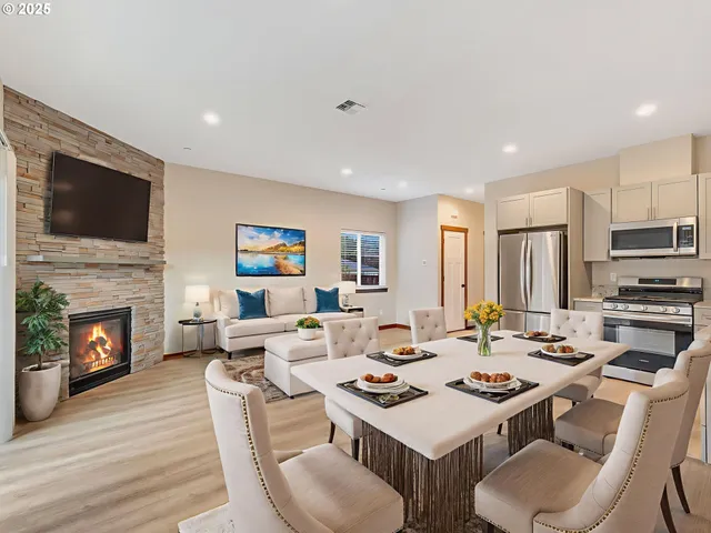 a living room with fireplace furniture and a flat screen tv