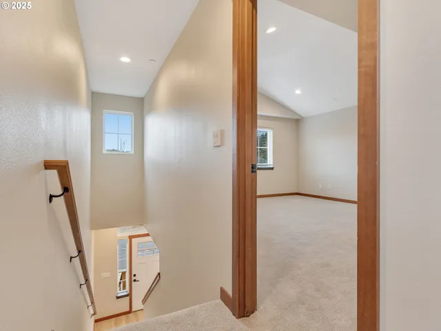 a view of a hallway with front door