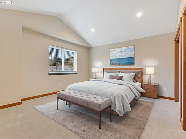 a bedroom with bed and a window