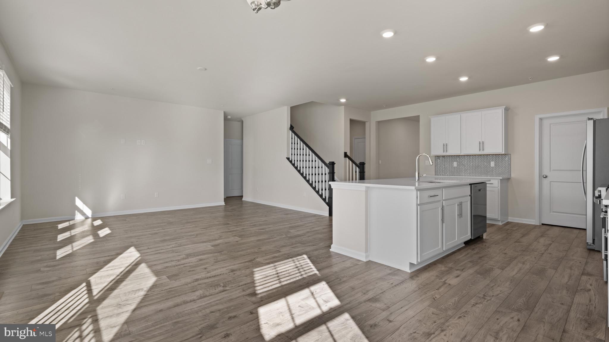 8 Comes Rdg Court Rosedale, MD 21237 - Photo 11 of 54 a view of a kitchen with furniture and wooden floor