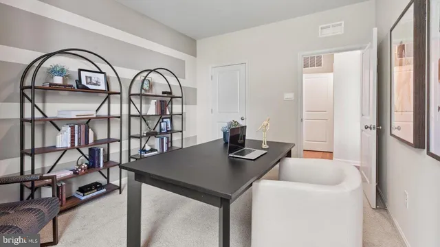 a view of a livingroom with furniture window and wooden floor