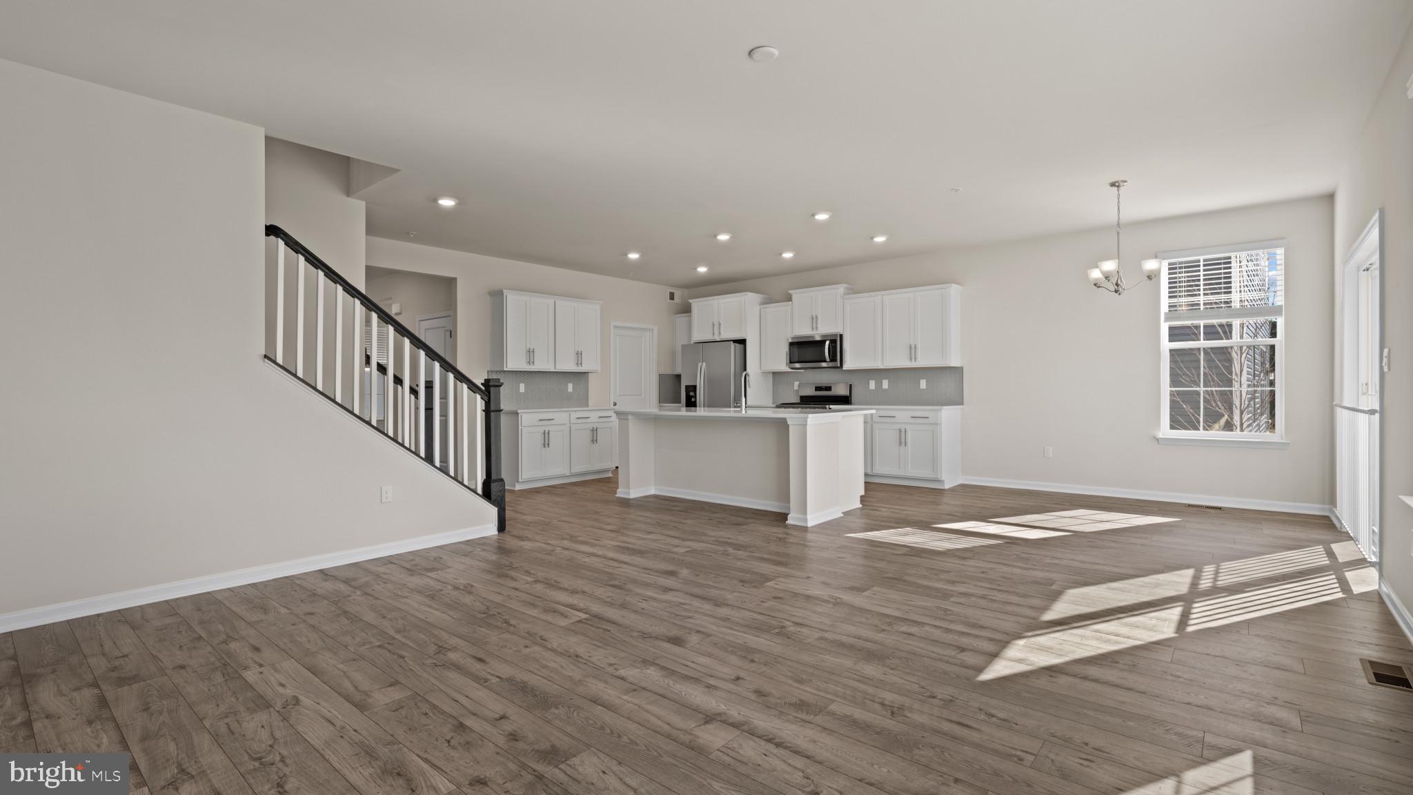 8 Comes Rdg Court Rosedale, MD 21237 - Photo 12 of 54 a view of kitchen with wooden floor and electronic appliances