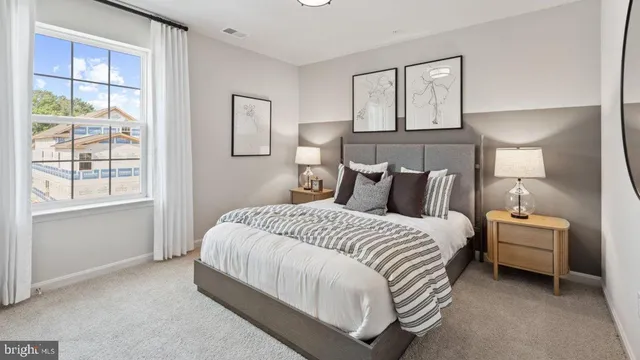 a bedroom with bed and window