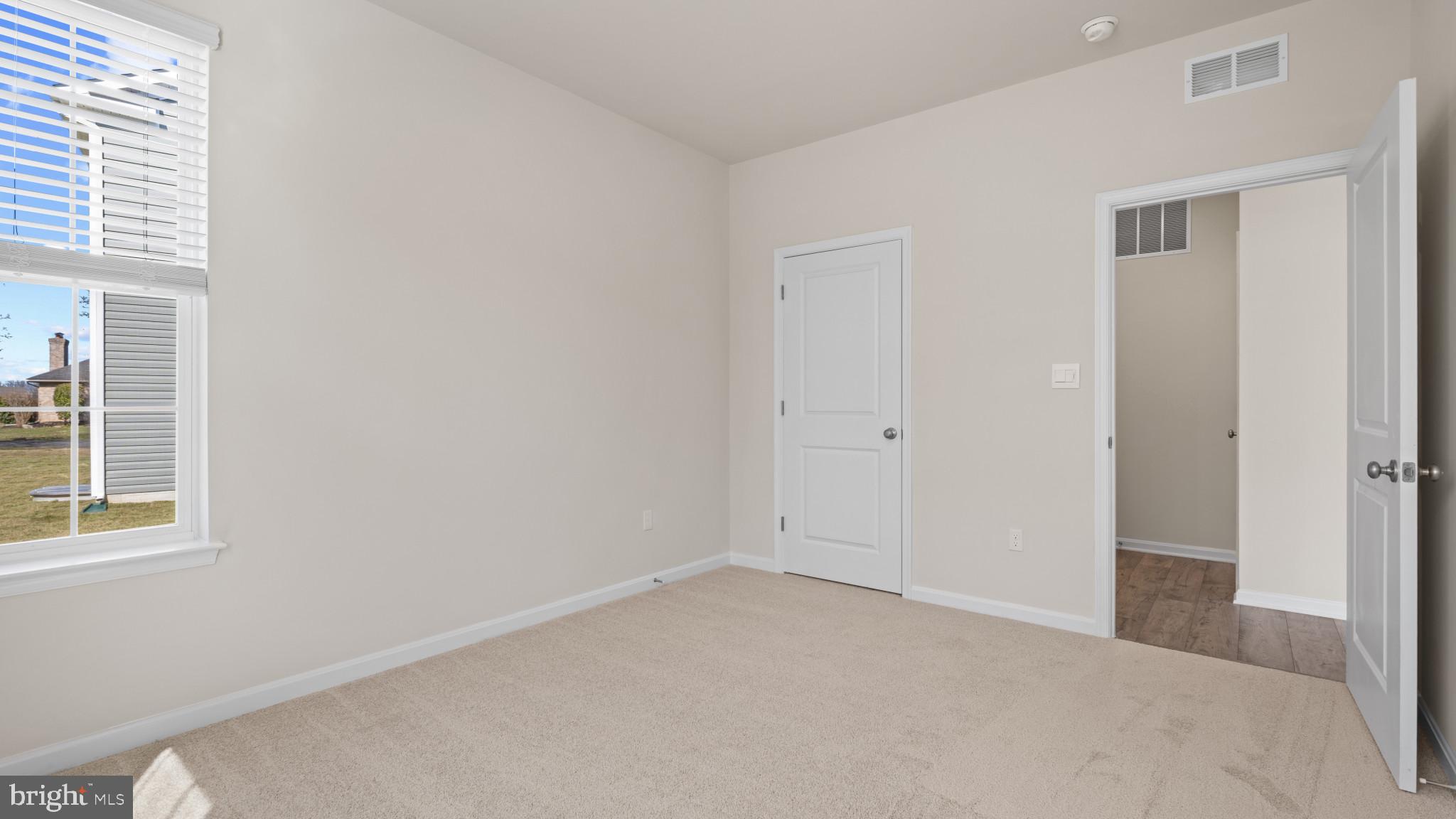 8 Comes Rdg Court Rosedale, MD 21237 - Photo 14 of 54 an empty room with windows