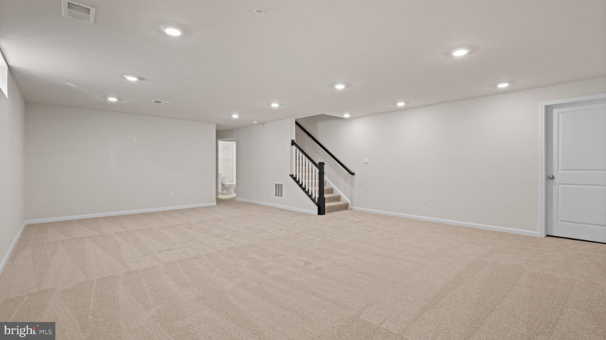 8 Comes Rdg Court Rosedale, MD 21237 - Photo 17 of 54 an empty room with stairs and windows