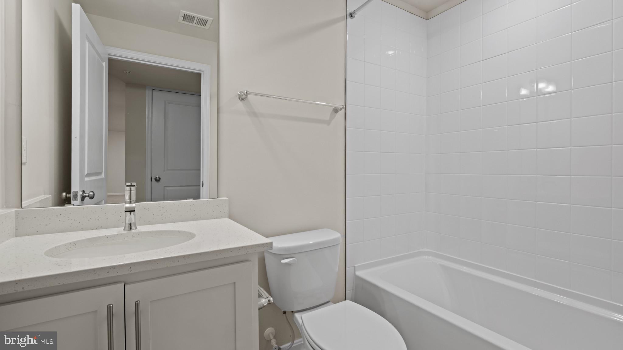 8 Comes Rdg Court Rosedale, MD 21237 - Photo 20 of 54 a bathroom with a sink toilet and shower