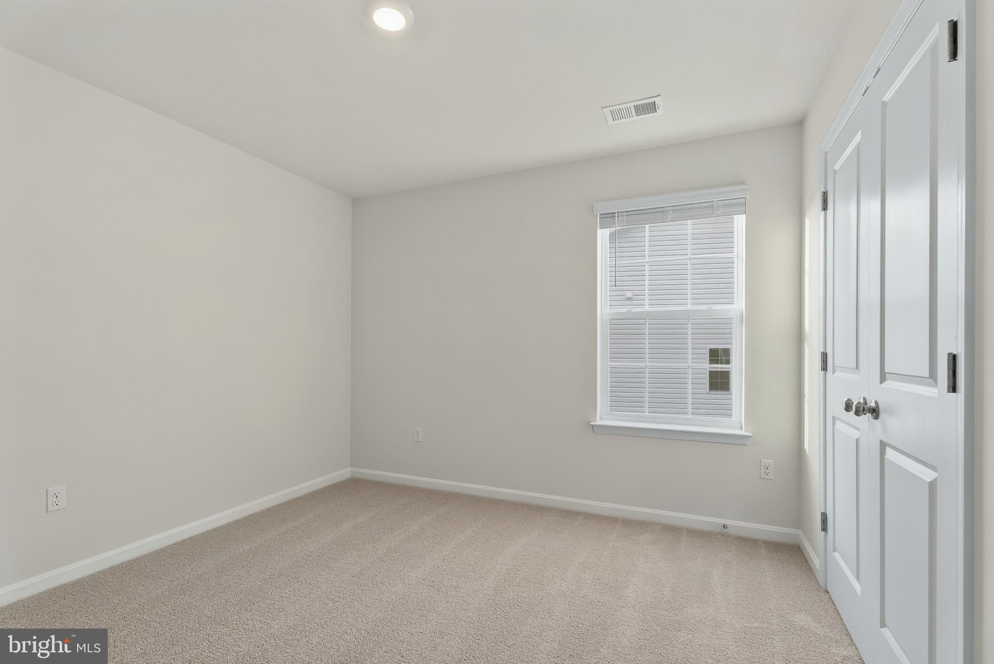 8 Comes Rdg Court Rosedale, MD 21237 - Photo 21 of 35 an empty room with windows