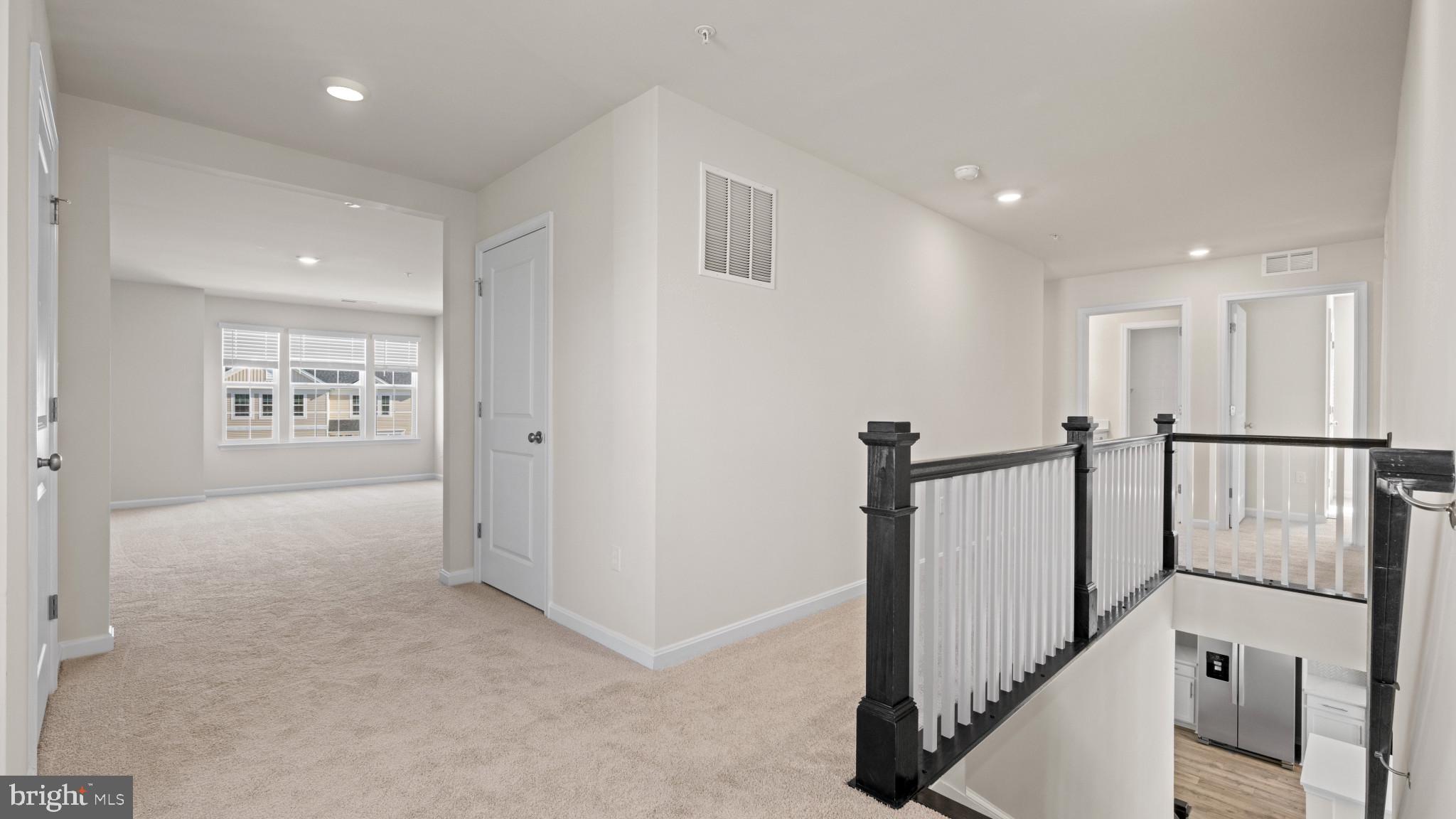 8 Comes Rdg Court Rosedale, MD 21237 - Photo 22 of 54 a view of a hallway with wooden floor and windows