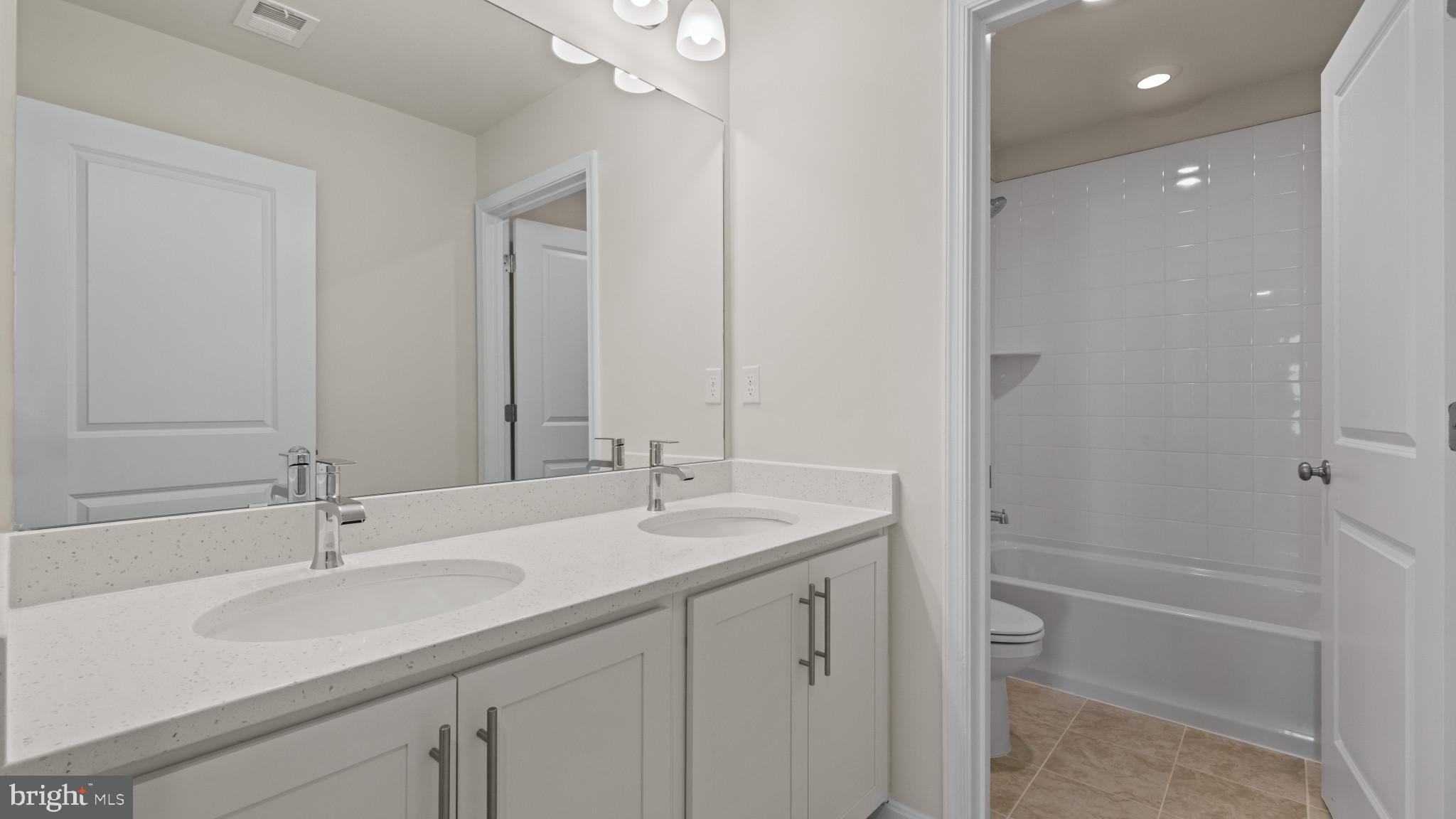 8 Comes Rdg Court Rosedale, MD 21237 - Photo 27 of 54 a bathroom with a sink double vanity granite tub and shower