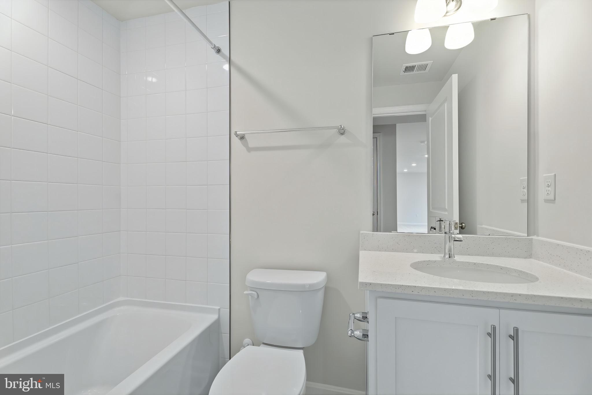 8 Comes Rdg Court Rosedale, MD 21237 - Photo 28 of 35 a bathroom with a sink a toilet and shower