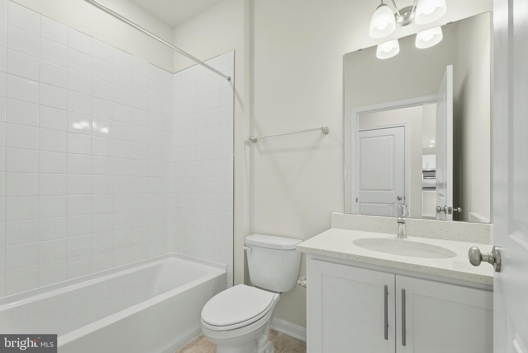 8 Comes Rdg Court Rosedale, MD 21237 - Photo 29 of 35 a bathroom with a sink a toilet and shower