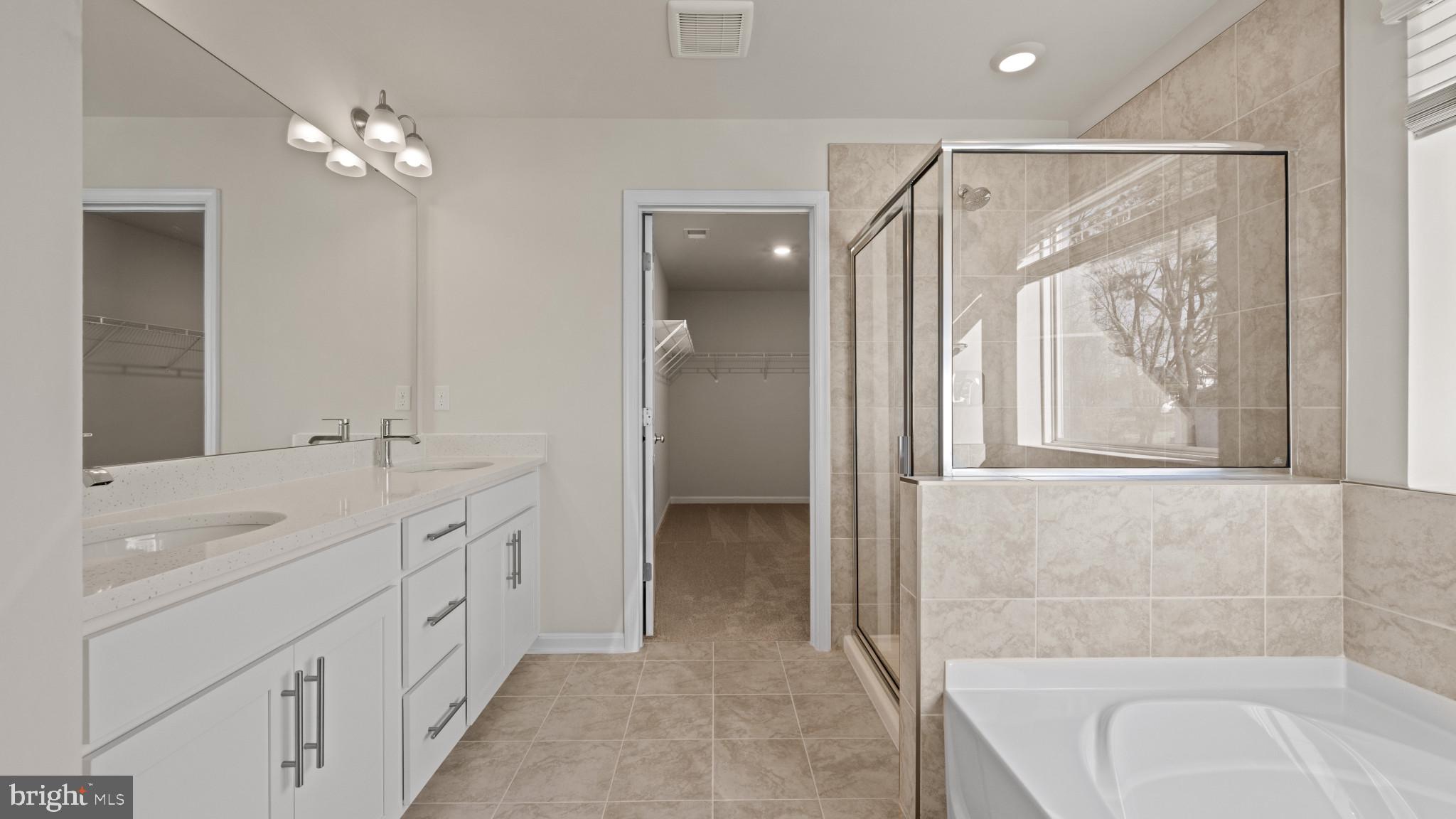 8 Comes Rdg Court Rosedale, MD 21237 - Photo 35 of 54 a bathroom with a double vanity sink mirror and bathtub