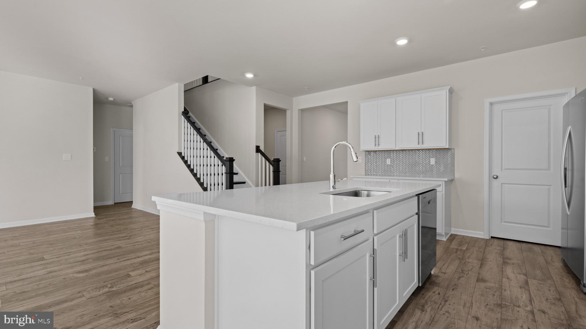 8 Comes Rdg Court Rosedale, MD 21237 - Photo 9 of 54 a kitchen with a sink a stove and cabinets