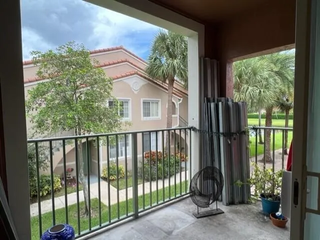 a view of a balcony with plants