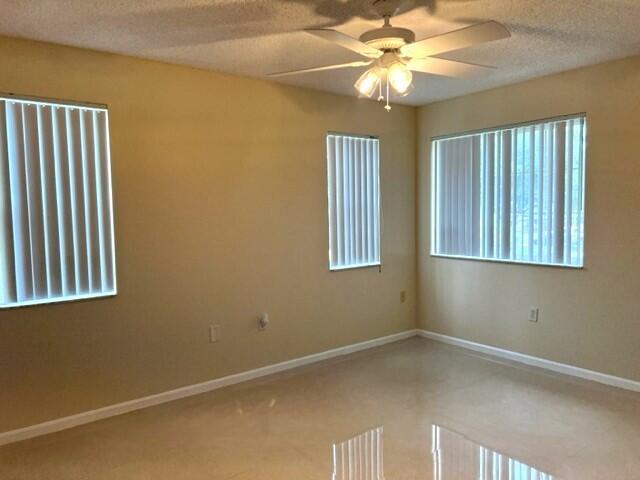 7848 Sonoma Springs Circle, Unit 202 Lake Worth, FL 33463 - Photo 7 of 16 a view of an empty room with a window