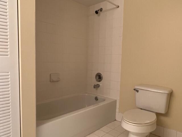 7848 Sonoma Springs Circle, Unit 202 Lake Worth, FL 33463 - Photo 8 of 16 a white toilet sitting next to a bath tub