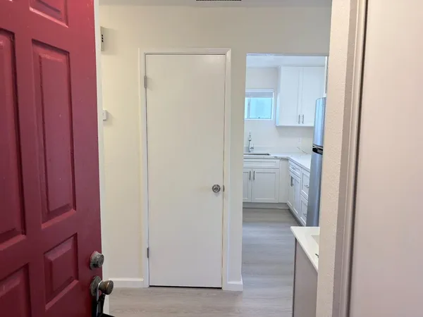 a bathroom with a granite countertop sink