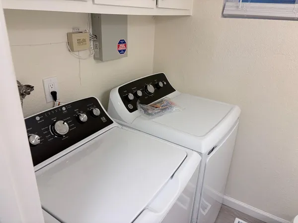 a utility room with dryer and washer