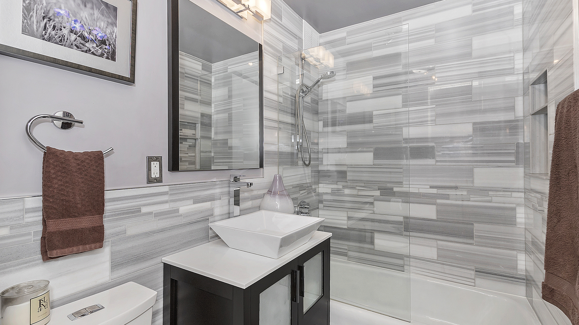 655 West Irving Park Road, Unit 915 Chicago, IL 60613 - Photo 11 of 18 a bathroom with a sink and a mirror