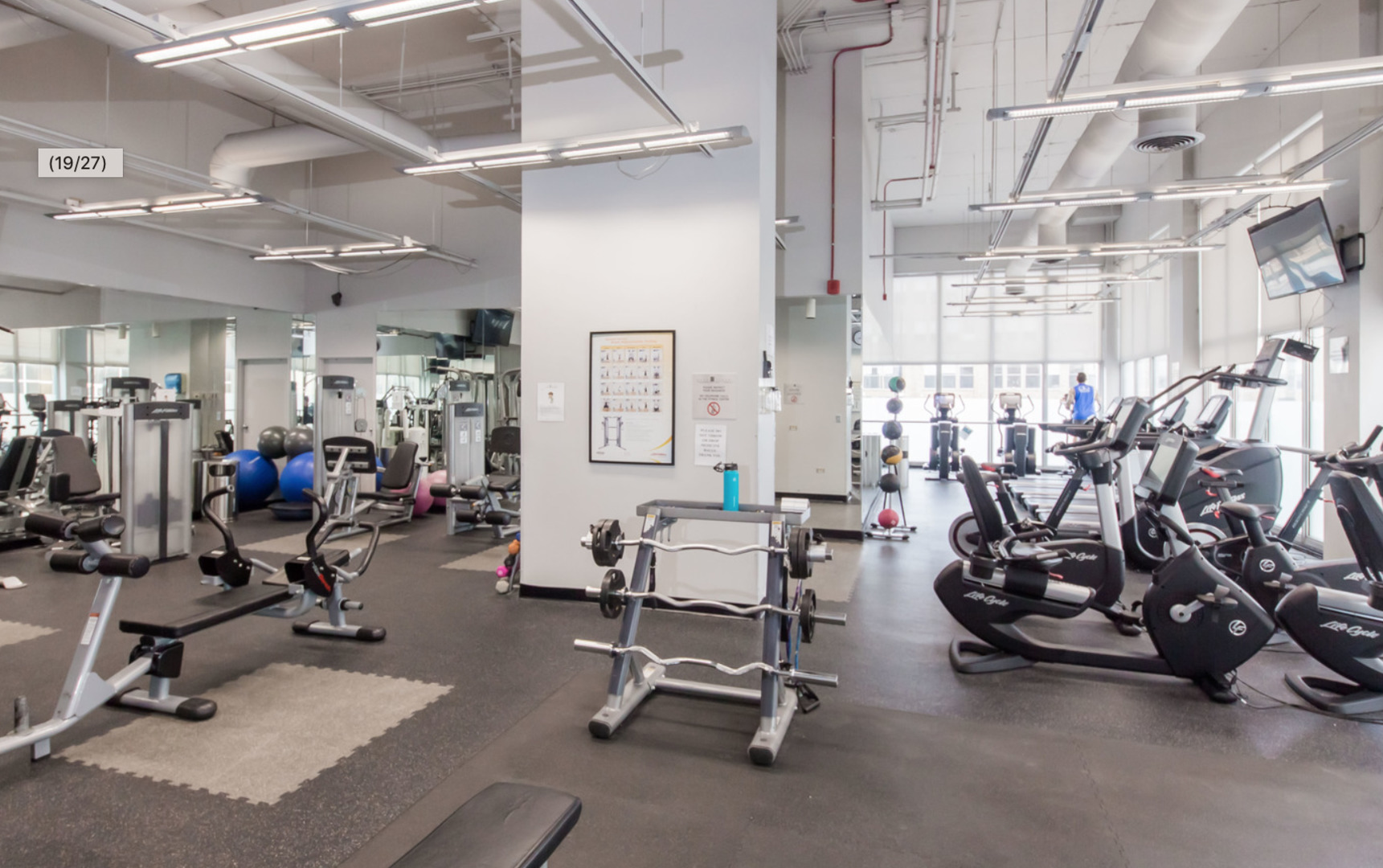 655 West Irving Park Road, Unit 915 Chicago, IL 60613 - Photo 13 of 18 a view of a room with gym equipment