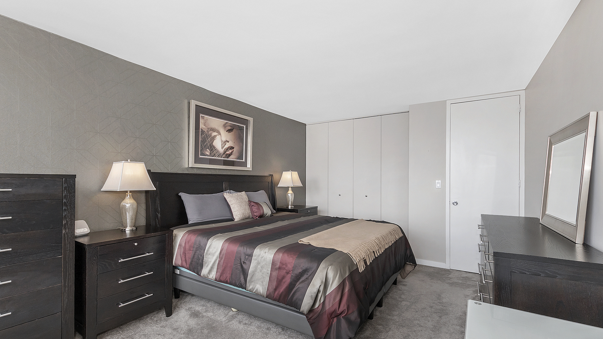 655 West Irving Park Road, Unit 915 Chicago, IL 60613 - Photo 10 of 18 a bed room with a bed and a night stand