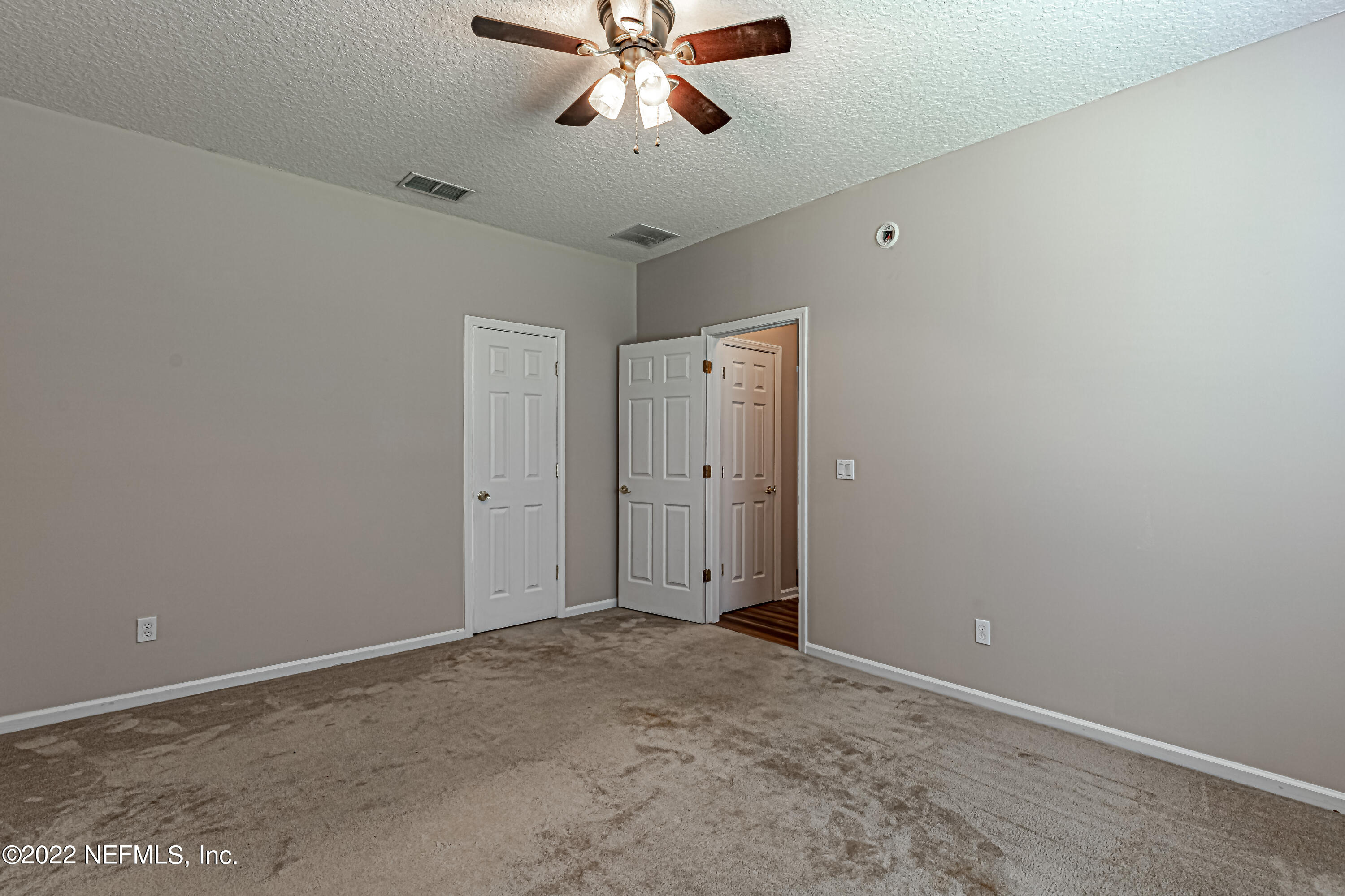 2497 Tall Cedars Road Fleming Island, FL 32003 - Photo 21 of 67 1st FL Bedroom w/ walk-in closet