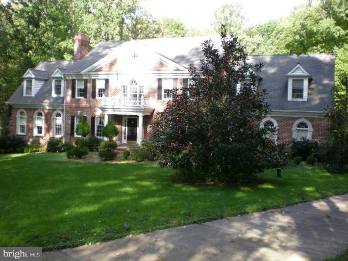 13923 Sunnybrook Road Phoenix, MD 21131 - Photo 1 of 10 a view of a white house next to a yard with big trees