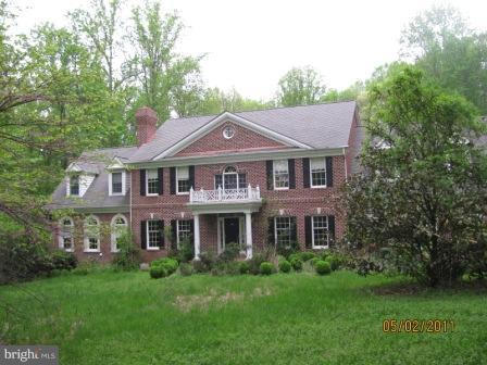 13923 Sunnybrook Road Phoenix, MD 21131 - Photo 5 of 10 a front view of a house with a yard