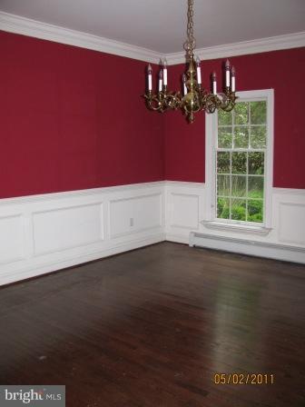 13923 Sunnybrook Road Phoenix, MD 21131 - Photo 9 of 10 a view of a room with wooden floor and potted plants