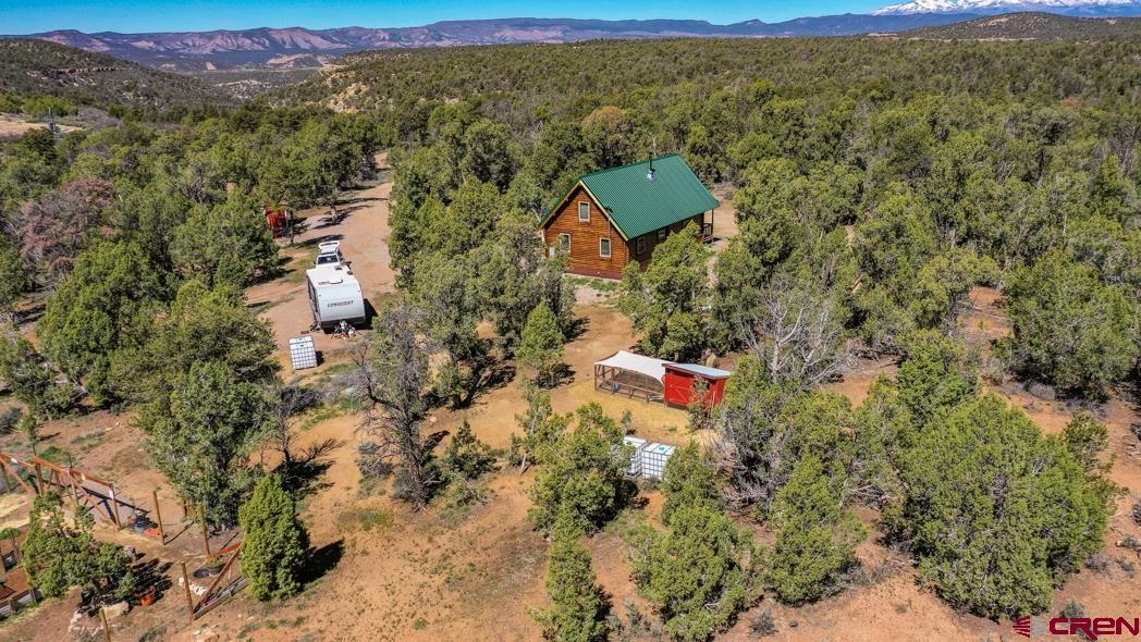553 Cow Canyon Road Ignacio, CO 81137 - Photo 30 of 34 an aerial view of residential house with outdoor space and trees all around