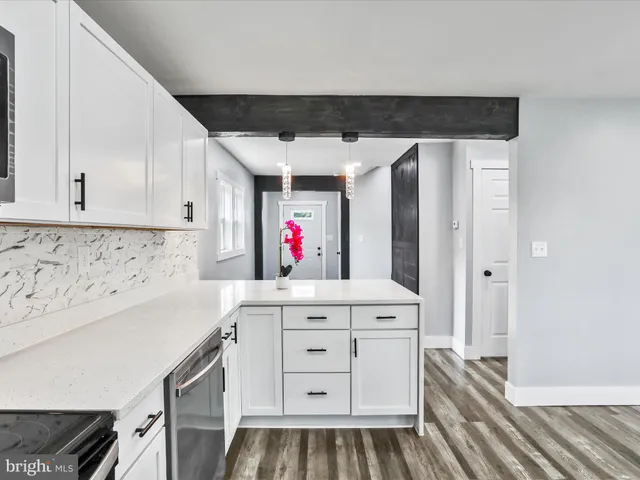 a kitchen with stainless steel appliances a cabinets and a counter top