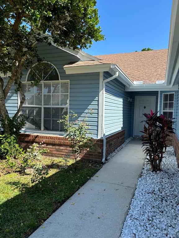 a house view with a garden space
