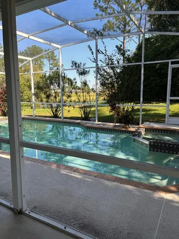 a view of swimming pool from a lake view