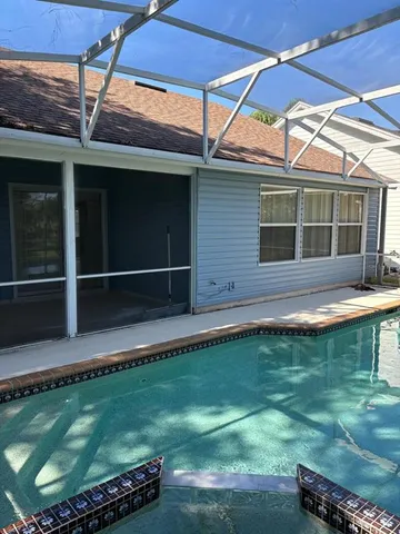 a view of a backyard with a small pool