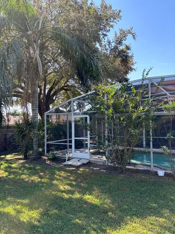 a view of a swimming pool with sitting area