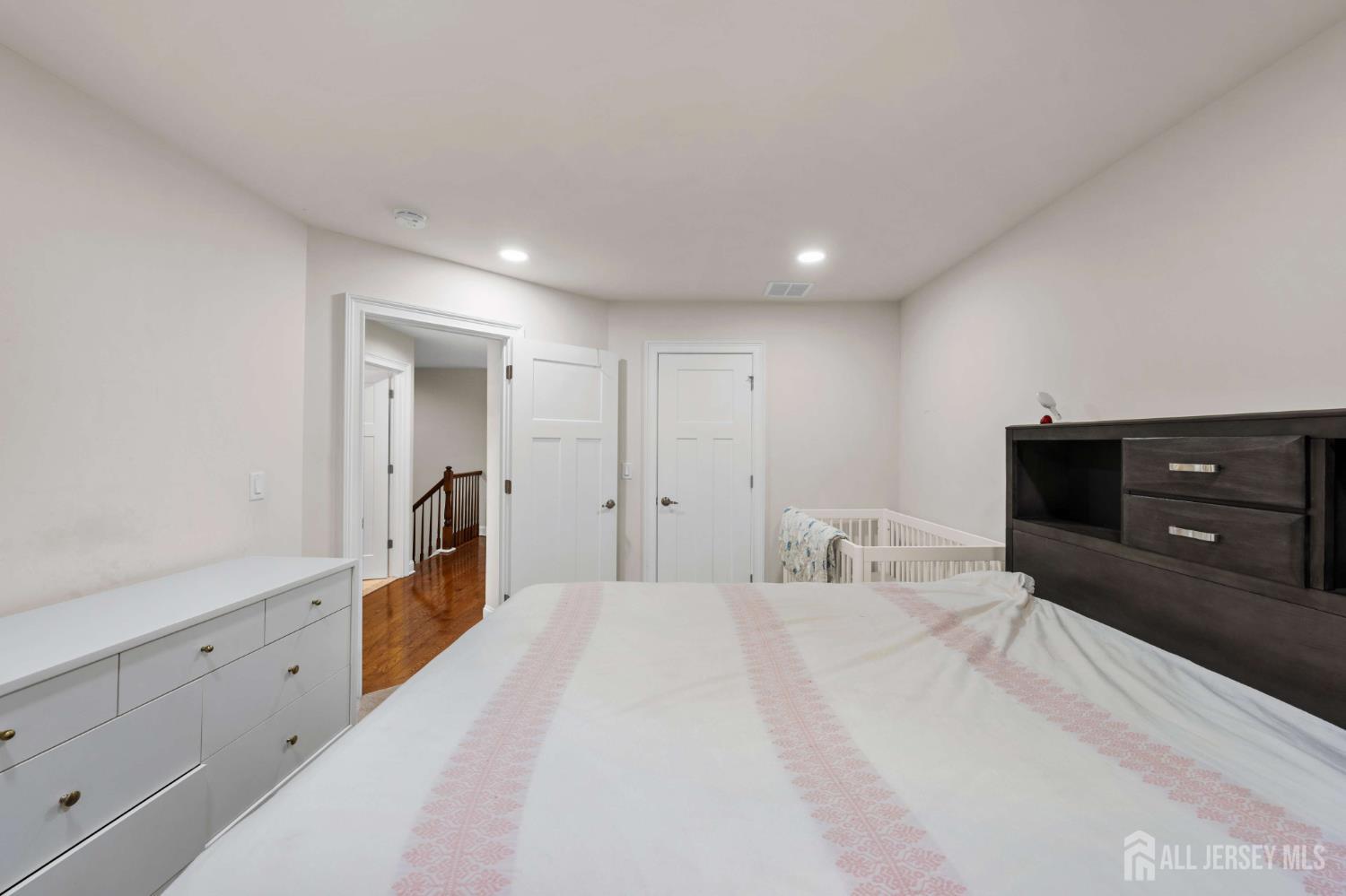 2 Gonzalez Drive Old Bridge, NJ 08857 - Photo 25 of 49 a spacious bedroom with a bed and a dresser