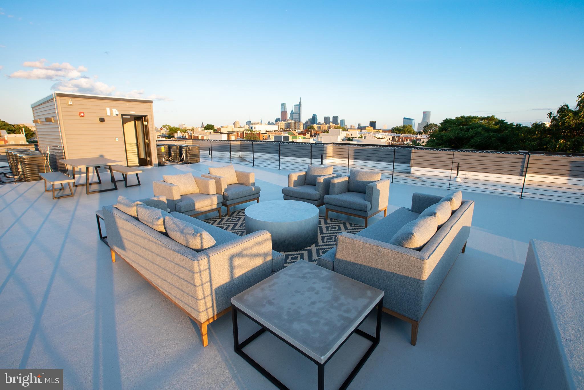 2940 West Thompson Street, Unit 302 Philadelphia, PA 19121 - Photo 13 of 43 a view of a terrace with couches and city view